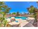 Stunning backyard oasis features a sparkling pool, spa, and mature landscaping perfect for outdoor entertaining at 361 Tobler Dr, Las Vegas, NV 89145