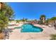 Inviting pool and spa with lush landscaping, creating a private backyard oasis at 361 Tobler Dr, Las Vegas, NV 89145