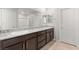 Elegant primary bathroom featuring dual sinks, granite countertops, and ample storage at 382 Scarlet Pine Ct, Henderson, NV 89044
