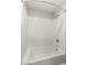 Crisp white tub and shower combination with subway tile and modern fixtures at 382 Scarlet Pine Ct, Henderson, NV 89044