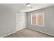 Neutral bedroom with carpeted floors, closet with bi-fold doors, and a window at 382 Scarlet Pine Ct, Henderson, NV 89044