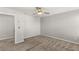 Bright bedroom with neutral carpet, and ceiling fan, ready for personalization at 382 Scarlet Pine Ct, Henderson, NV 89044