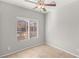 Bright bedroom features neutral walls and tile flooring with a window at 382 Scarlet Pine Ct, Henderson, NV 89044