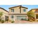 Two-story home with desert landscaping and a two-car garage at 382 Scarlet Pine Ct, Henderson, NV 89044
