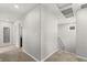 Upstairs hallway with neutral carpet and paint, featuring a linen closet, and recessed lighting at 382 Scarlet Pine Ct, Henderson, NV 89044