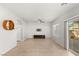 Bright living room features tile flooring, large window and modern fixtures at 382 Scarlet Pine Ct, Henderson, NV 89044