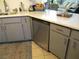 Modern kitchen featuring stainless steel dishwasher, sink and gray cabinets at 432 Sellers Pl, Henderson, NV 89011