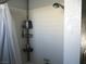 Shower with tiled walls, shower caddy, and a shower head at 432 Sellers Pl, Henderson, NV 89011
