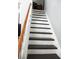 A clean staircase with wooden handrail and white risers leading to the upper level at 432 Sellers Pl, Henderson, NV 89011