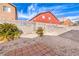 A low-maintenance backyard is xeriscaped with desert plants and a stone paver walkway at 4381 Coyote Crest Ct, Las Vegas, NV 89147