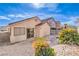 Backyard featuring desert landscaping, stone pavers, and cinder block perimeter walls at 4381 Coyote Crest Ct, Las Vegas, NV 89147