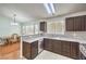 Granite countertop kitchen island overlooks dining room at 4381 Coyote Crest Ct, Las Vegas, NV 89147