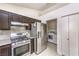 Spacious kitchen features stainless steel appliances and laundry area at 4381 Coyote Crest Ct, Las Vegas, NV 89147