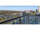 Balcony view showcasing city skyline, lush greenery, and distant mountains at 4381 W Flamingo Rd # 9301, Las Vegas, NV 89103