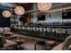 Stylish bar area with comfortable lounge seating, a stone accent wall, and fully stocked bar at 4381 W Flamingo Rd # 9301, Las Vegas, NV 89103