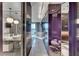 Modern bathroom featuring dual vanities, marble walls, pendant lighting and a soaking tub with city view at 4381 W Flamingo Rd # 9301, Las Vegas, NV 89103