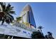 Stunning Palms Place tower featuring a modern design, palm trees, and a vibrant atmosphere at 4381 W Flamingo Rd # 9301, Las Vegas, NV 89103