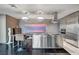 Sleek, modern kitchen with stainless steel appliances, island seating, and contemporary lighting at 4381 W Flamingo Rd # 9301, Las Vegas, NV 89103