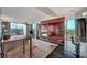 Open-concept living area with modern furniture, floor-to-ceiling windows with city views, and sleek design at 4381 W Flamingo Rd # 9301, Las Vegas, NV 89103