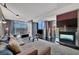 Bright living room showcases a comfortable sectional, fireplace, and city views at 4381 W Flamingo Rd # 9301, Las Vegas, NV 89103