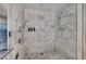 Modern walk-in shower featuring marble walls and rain shower head at 4381 W Flamingo Rd # 9301, Las Vegas, NV 89103