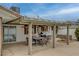 Backyard featuring covered patio, ceiling fans, built-in grill, and an inground pool at 4678 San Benito St, Las Vegas, NV 89121