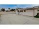 Spacious backyard featuring a basketball hoop, solar panels, and white privacy fence at 4678 San Benito St, Las Vegas, NV 89121