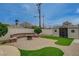 Backyard featuring a brick paved patio area, a built in brick seating area, and a storage shed at 4678 San Benito St, Las Vegas, NV 89121