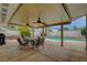 Entertain in this backyard with covered patio, ceiling fans, inground pool, and privacy fence at 4678 San Benito St, Las Vegas, NV 89121