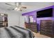 The primary bedroom includes an open closet and matching wood-look dresser at 4678 San Benito St, Las Vegas, NV 89121