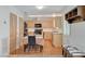 Dining area adjacent to kitchen with wood cabinets and plenty of storage space at 4678 San Benito St, Las Vegas, NV 89121