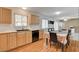 The dining area offers an eat-in kitchen with wood cabinets and a stainless steel dishwasher at 4678 San Benito St, Las Vegas, NV 89121