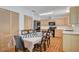 Dining area near the kitchen, featuring matching cabinets and stainless appliances at 4678 San Benito St, Las Vegas, NV 89121