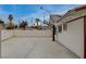 Extra long concrete driveway leads to a basketball hoop and backyard access at 4678 San Benito St, Las Vegas, NV 89121