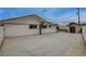 Long driveway leading to storage shed and fenced-in basketball court at 4678 San Benito St, Las Vegas, NV 89121