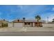 Charming single-story home featuring a two-car garage, brick accents, and well-maintained landscaping at 4678 San Benito St, Las Vegas, NV 89121