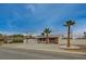 Well-maintained home with desert landscaping and mature palm trees at 4678 San Benito St, Las Vegas, NV 89121