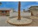 View of the front yard showing a well-kept desert landscape with white fencing at 4678 San Benito St, Las Vegas, NV 89121