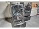 Laundry room with front loading washer and dryer, and a sliding storage drawer at 4678 San Benito St, Las Vegas, NV 89121