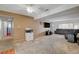 Bright living room with large entertainment center, providing ample seating and relaxation at 4678 San Benito St, Las Vegas, NV 89121