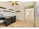 Bright bedroom features wood-look flooring and contemporary floating shelves at 5024 Stone Bay Ave, Las Vegas, NV 89131