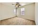 Bedroom features neutral walls, carpet flooring, and natural lighting from two windows at 5024 Stone Bay Ave, Las Vegas, NV 89131