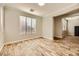 Bright, airy bedroom with wood tile floors and neutral walls at 5024 Stone Bay Ave, Las Vegas, NV 89131
