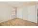 This bedroom includes carpet flooring, neutral paint, and sliding closet doors at 5024 Stone Bay Ave, Las Vegas, NV 89131