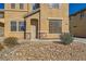 Inviting front entrance with stylish desert landscaping and stone accents at 5024 Stone Bay Ave, Las Vegas, NV 89131