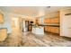 Well-equipped kitchen featuring an island, stainless steel appliances, and tile floors at 5024 Stone Bay Ave, Las Vegas, NV 89131