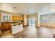 Eat-in kitchen boasting a central island, wood cabinets, and tile flooring at 5024 Stone Bay Ave, Las Vegas, NV 89131
