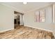 Bright living area featuring wood look tile flooring and neutral walls at 5024 Stone Bay Ave, Las Vegas, NV 89131