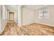 Bright living room showcasing wood-look flooring and lots of natural light at 5024 Stone Bay Ave, Las Vegas, NV 89131