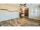 Living room with wood-look flooring; kitchen visible in background at 5024 Stone Bay Ave, Las Vegas, NV 89131